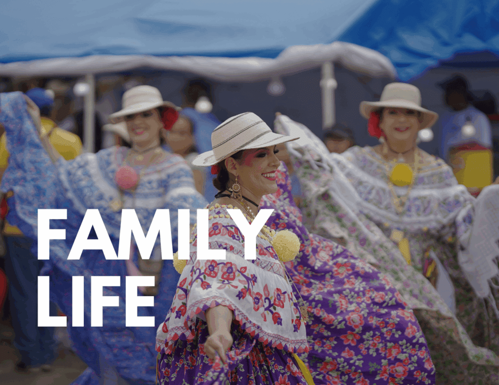Women in traditional Panamanian dress dancing at a festival — showing local culture and family life.