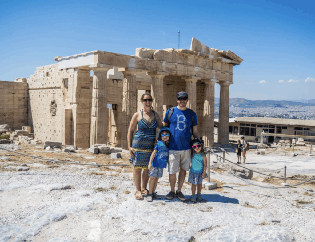Family of five exploring ancient ruins in Athens — Family Voyage blog captures long-term travel and worldschooling in action.