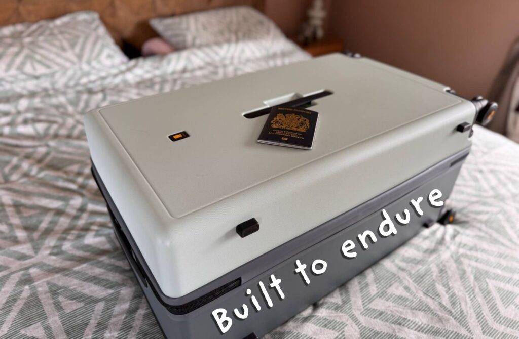 Mint suitcase with passport resting on top in cozy bedroom