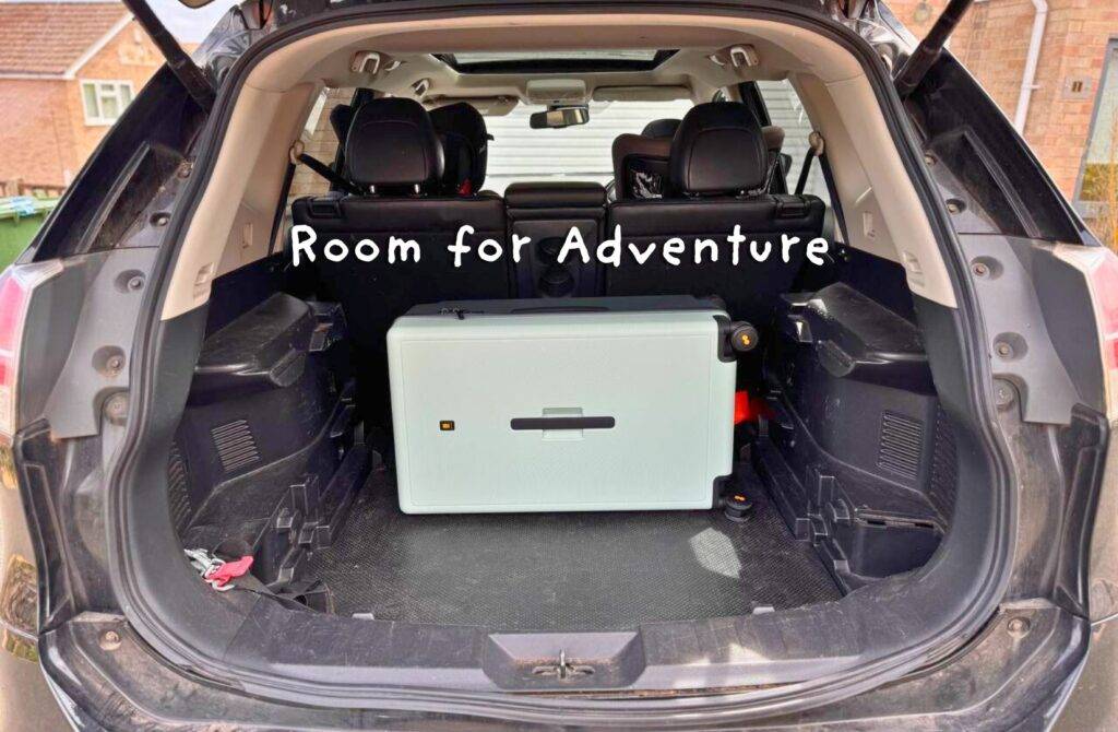 Suitcase fits neatly in car boot ready for travel