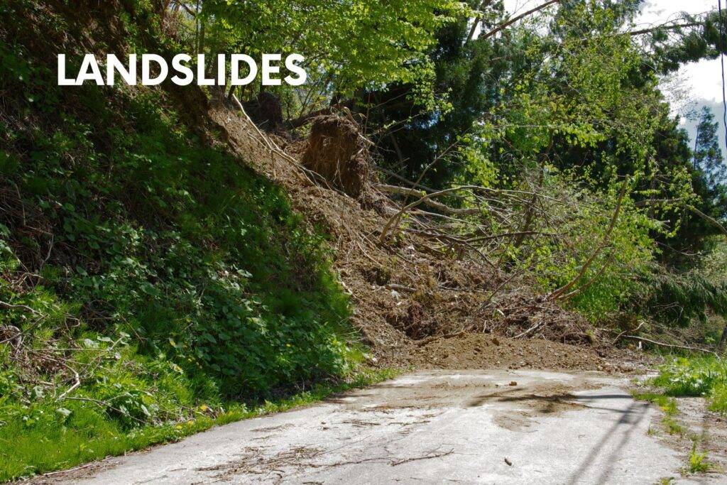 Landslide debris blocking a mountain road—road safety advice for family travelers.