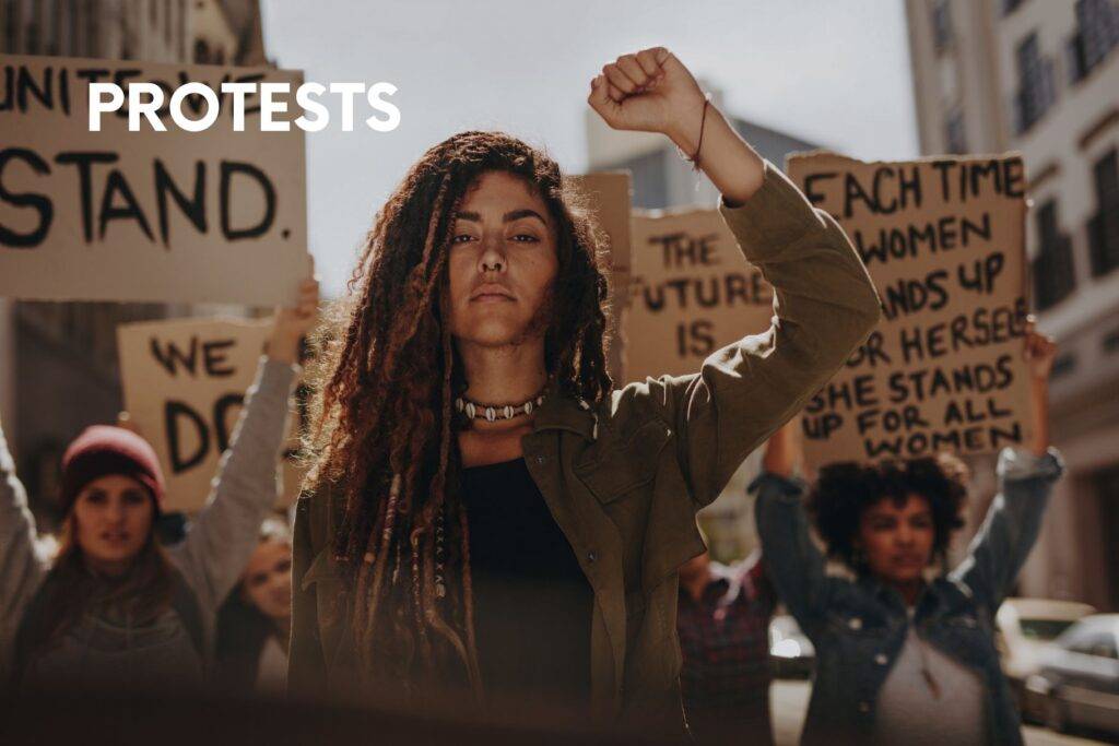 People protesting in a city—how families should avoid and navigate demonstrations.