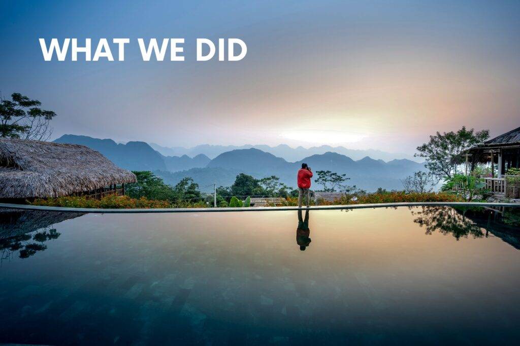 Traveller by a mountain lodge infinity pool at sunrise — what we did to stay safe on the road.