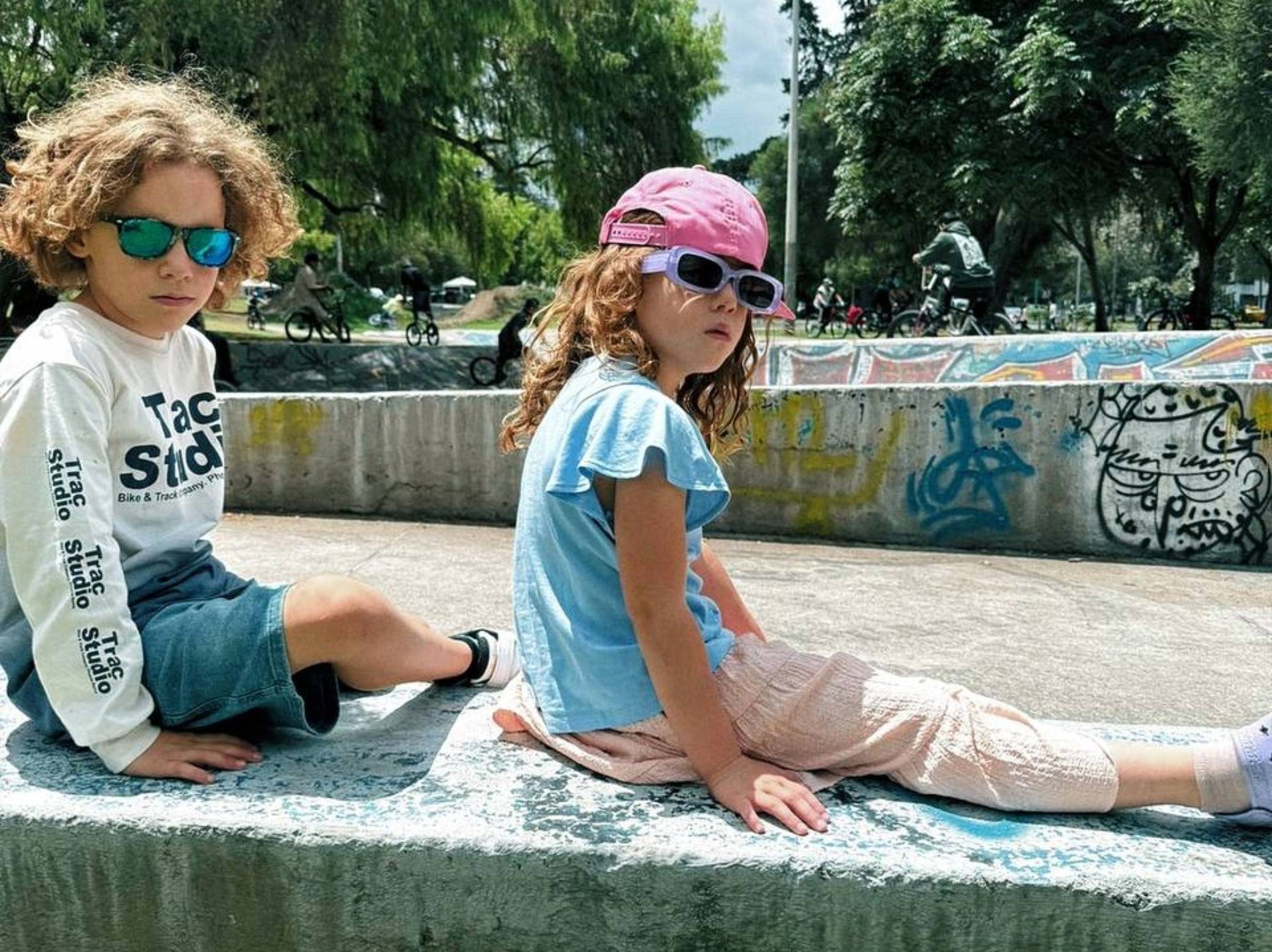 Atty and Aurie sitting on a bench looking cool in Quito