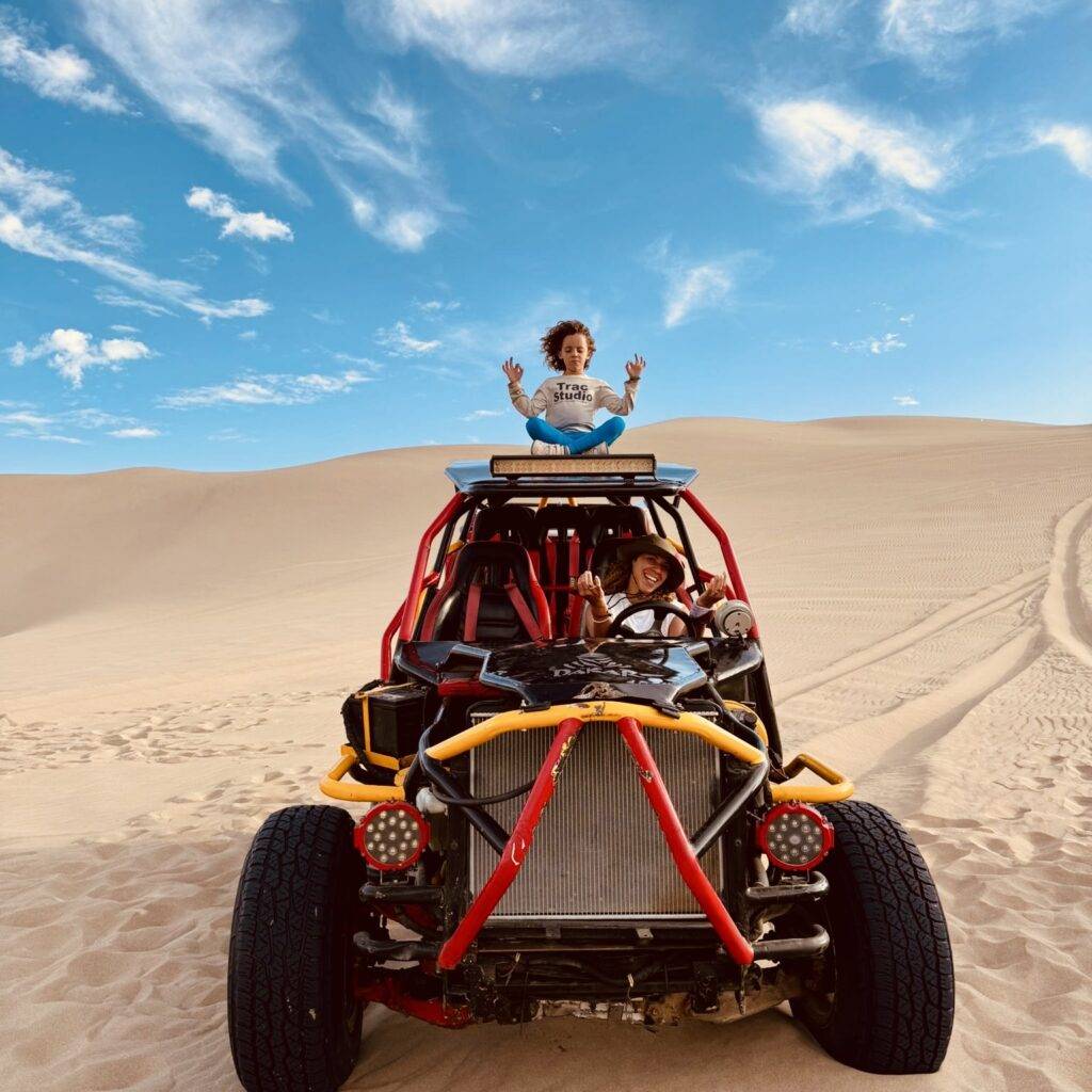 Kid meditating on buggy in the desert